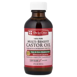 Frasco de vidrio ámbar con aceite de ricino De La Cruz 100% puro, grado USP, presentación de 59 ml, para hidratación de cabello, piel y uso laxante.
